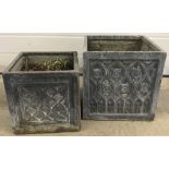 2 square concrete effect garden planters with decorative sides.