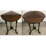 A triangular shaped drop leaf occasional table with turned legs.