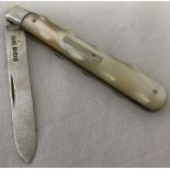 A silver bladed mother of pearl handled fruit knife with blank rectangular cartouche.