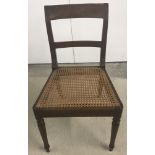 A cane seated hall chair.
