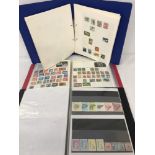 3 albums of world stamps.