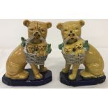 A pair of Staffordshire style pug dog figurines.