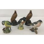 A collection of ceramic Beswick bird figurines.