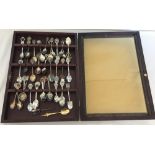 A small display case containing collector's spoons