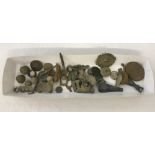 A small tin of metal detecting finds to include coins, thimbles and musket balls.