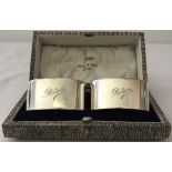 A pair of Walker & Hall boxed silver napkin rings, engraved to front "Peter".