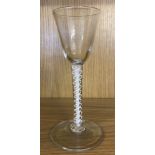 A Georgian clear glass liqueur glass with air twist stem and trumpet shaped bowl.
