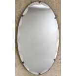 A vintage scalloped edge wall hanging mirror.