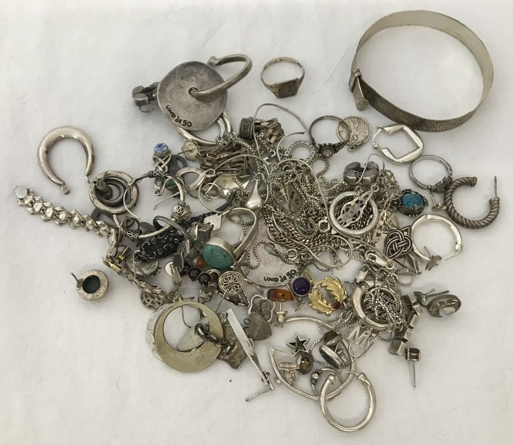 A large quantity of scrap white metal / silver jewellery.