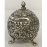 An silver 3 footed pepperette of spherical shape, possibly persian silver.