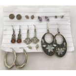 9 pairs of silver earrings.
