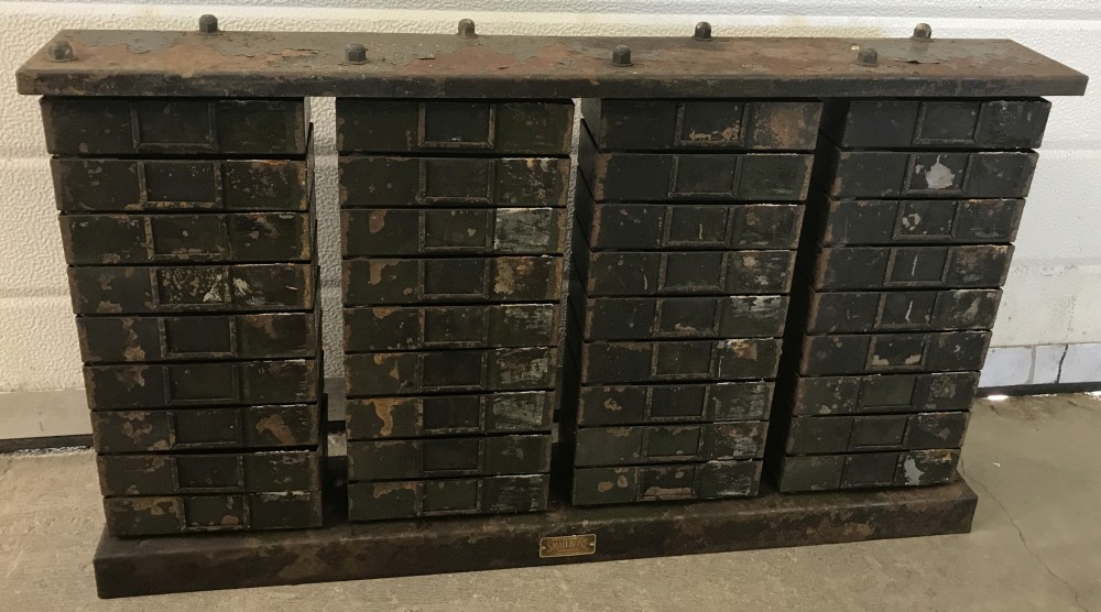 A set of vintage industrial swivel engineers drawers.