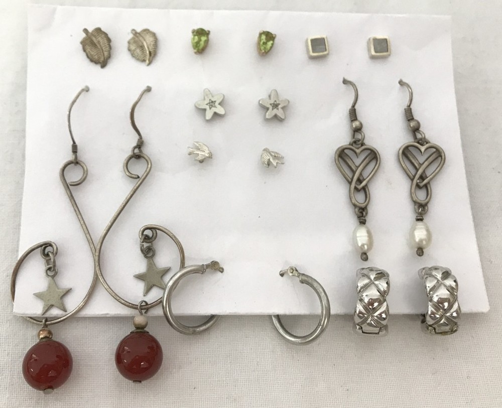 9 pairs of silver earrings.