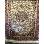 A brand new Keshan rug with beige backgrounds and navy, red and gold pattern.