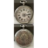 A vintage hallmarked silver ladies pocket watch with floral etched decoration to case
