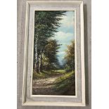 A framed oil on canvas of a woodland scene.