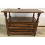 A solid oak TV table/cabinet.