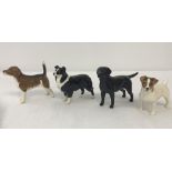 4 small Beswick dog figurines, to include 2 with gold stamps.