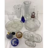 A box of assorted glassware to include bowls, vases, decorative bells and paperweights.