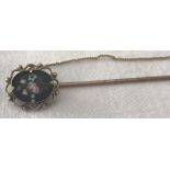 A Victorian Pietra Dura stick pin brooch depicting a floral spray.