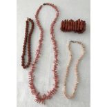 A small collection of coral jewellery with 1 other necklace.