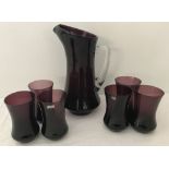 A vintage aubergine coloured Polish glass pitcher and 6 matching goblets by Krosno.