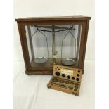 A set of vintage scientific scales with a boxed set of weights by Philip Harris & Co Ltd.