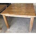 A modern solid oak wood kitchen/dining table.