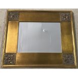 A modern gilt framed mirror with bevel edged glass.