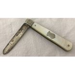A silver blade fruit knife with mother of pearl handle