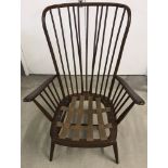 A large Ercol dark finish stick back bent frame easy chair.