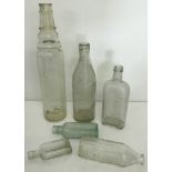 A small collection of vintage glass bottles.