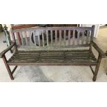A wooden garden bench with slatted seat and back.