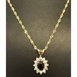 A 9ct gold sapphire & cubic zirconia pendant on 9ct gold rope chain .
