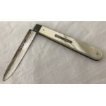 A Victorian silver blade fruit knife with mother of pearl handle and ridge detail.