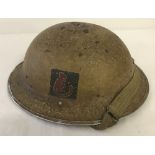 British WWII pattern 8th Army Tommy helmet with painted Desert Rat motif.