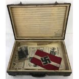 WWII pattern Hitler Youth suitcase together with an armband and photographs.