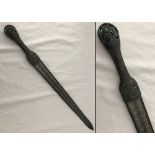 A bronze handled short sword with inlay detail to blade.