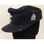 WWII pattern Hitler Youth Ski cap with late war HJ ersatz diamond badge and metal Edelweiss badge.