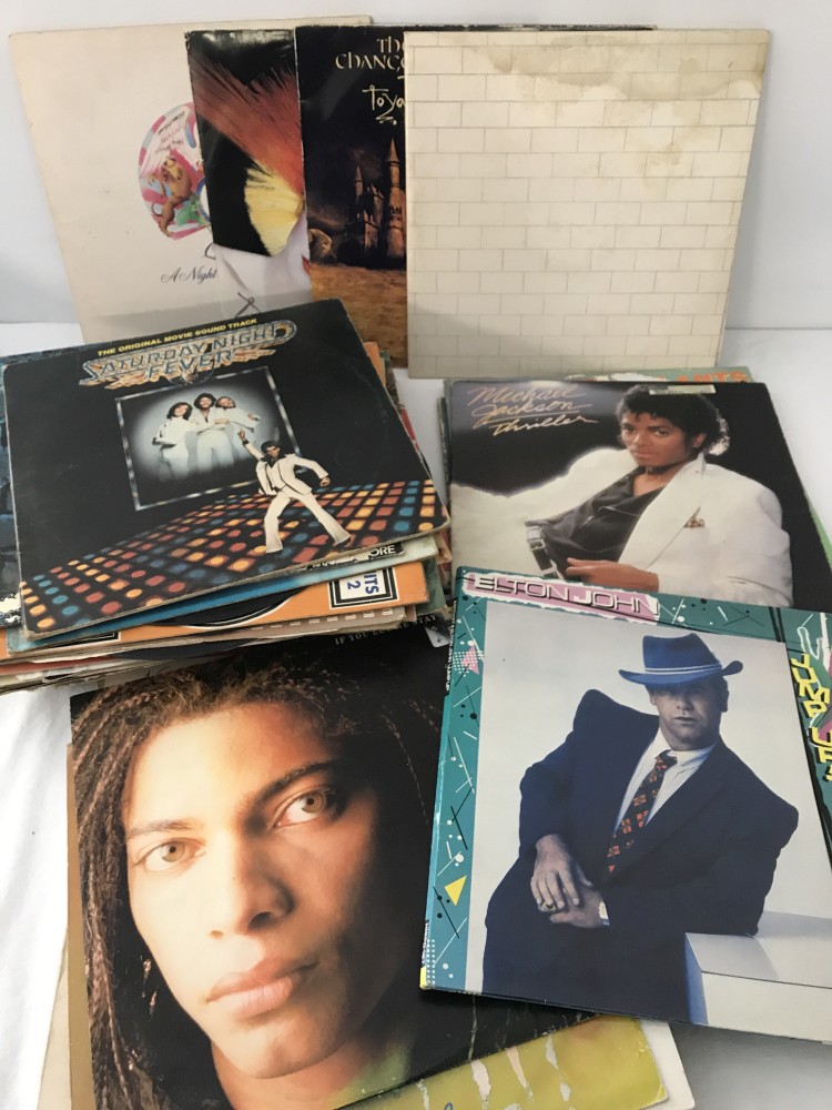 A collection of 12 inch records and LP's.