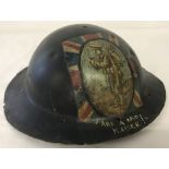 British WWI pattern Brodie helmet with trench art painting of a British Soldier.