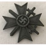 WWII pattern German War Merit pin back badge with swords 1st class.