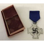 A boxed WWII pattern German party 25 year Service medal.