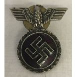 German WWII pattern enamelled party badge with eagle sitting on a swastika design.