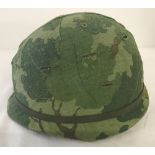 Vietnam War Era US helmet with reversible "Mitch" pattern cover.