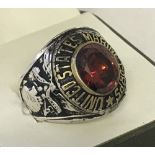 Reproduction Vietnam Era US Marines Corps ring set with large red stone.