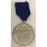 WWII pattern German Police 8 year service medal.