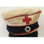 An Imperial German WW1 pattern Red Cross Feldmutze soft trench cap.