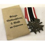 A German WWII pattern War Merit Cross medal with swords 2nd class.