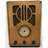 A reproduction wooden cased 1930's style radio.